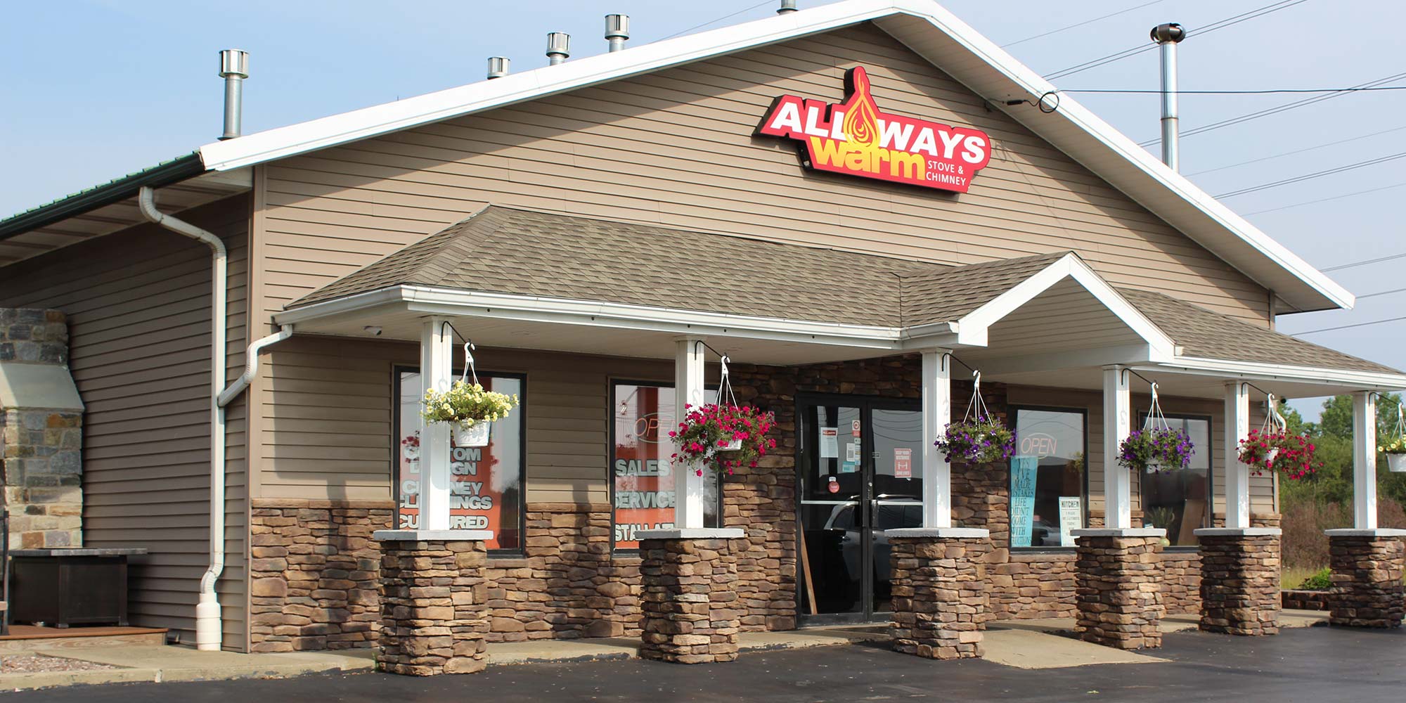 All Ways Store Front sunny day flowers arranged