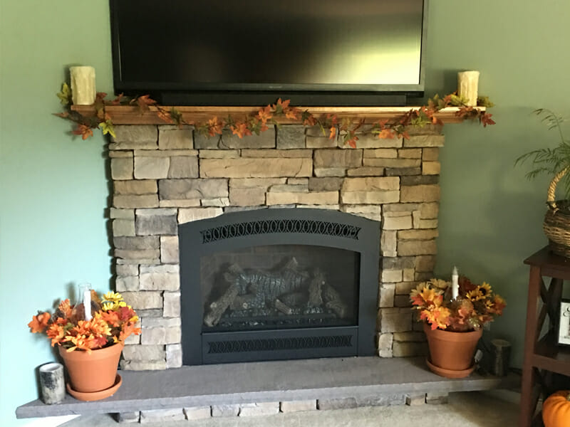 Autumnal display in front of fireplace