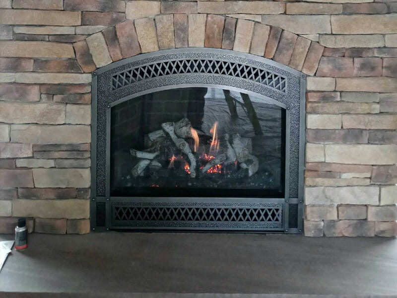 Wood burning in a stainless steel fireplace