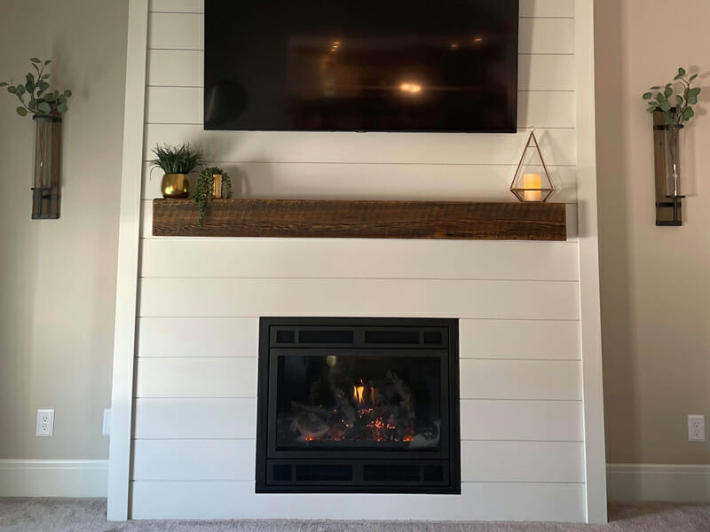 A fireplace installed in a wall with mantle above