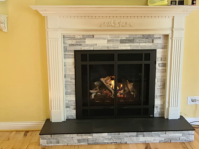 Dark black fireplace with bright white mantle