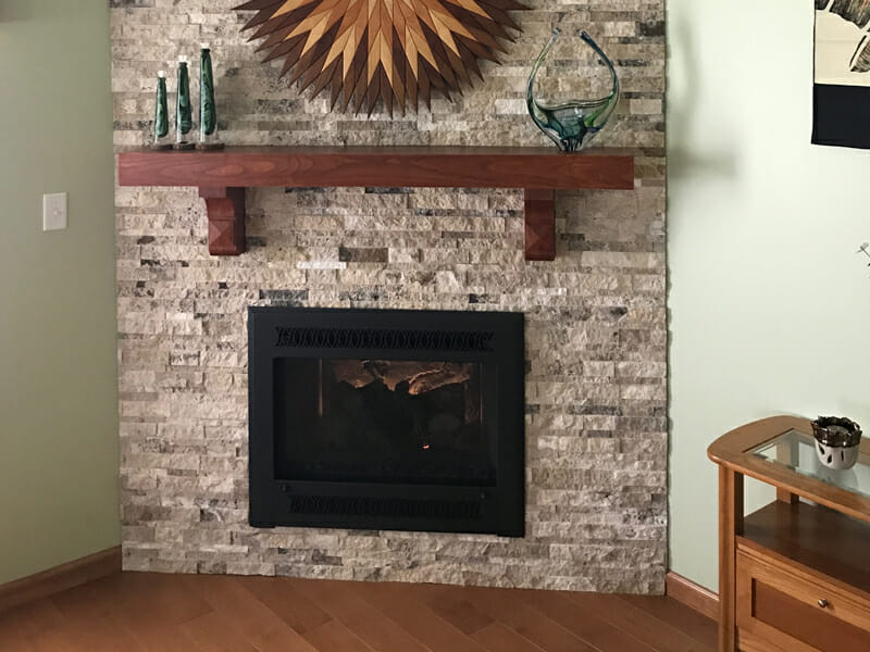 Fireplace with exotic jade objects on mantle above