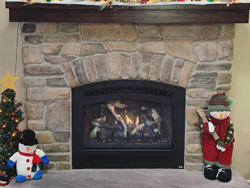 Fireplace with Christmas decorations on both sides