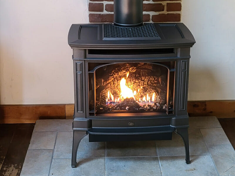 Clean brand new black stove burning bright